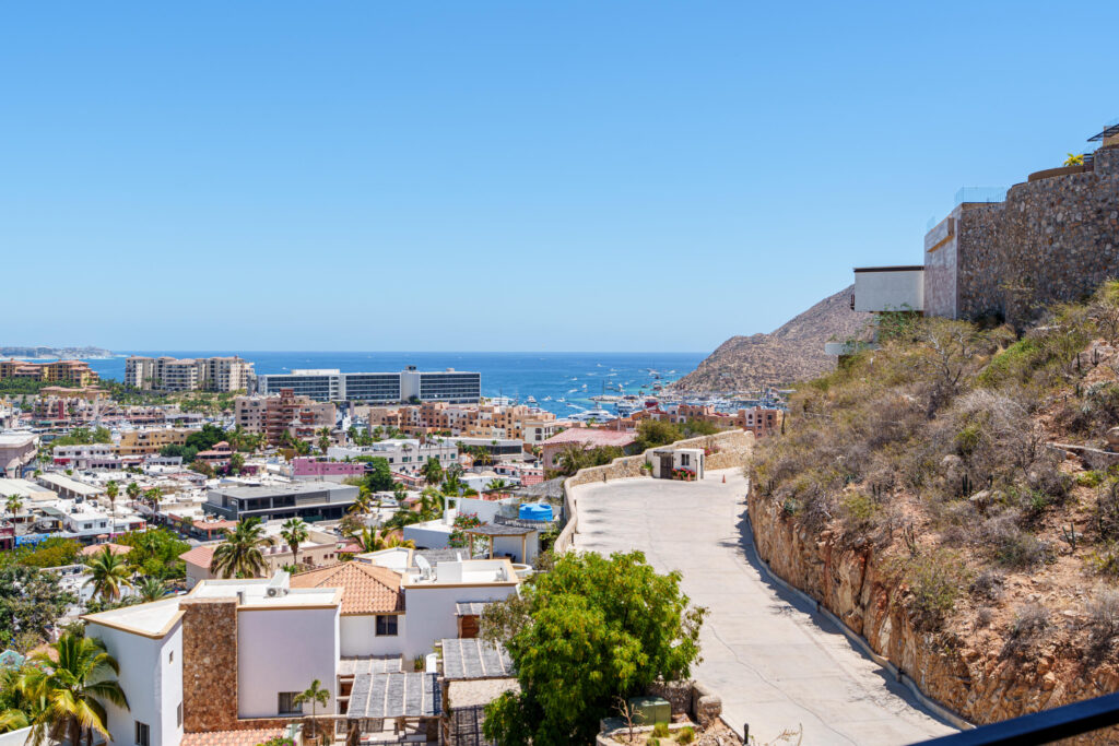 Los Cabos Brisas Del Tezal Ready for delivery! Brisas del Tezal second-floor condo featuring 2 bedrooms and 2 bathrooms in an exclusive low-density community of 36 units across two 4-story elevator buildings. Located minutes from Medano Beach and downtown Cabo. Showcases excellent construction quality and craftsmanship from the developer, including parota wood carpentry and a large, solid front door. Features large-format tile flooring throughout, spacious balcony, granite countertops and backsplash in the kitchen, bathrooms with marble showers to the ceiling, wall-to-wall closets, and a laundry room with space for side-by-side washer and dryer, plus manual washing area and storage. Equipped with 1-ton A/C mini-splits in each bedroom and two in the living area.Enjoy ocean, city, mountain, and sunset – 282 Cam. Grande, Cabo San Lucas, BS