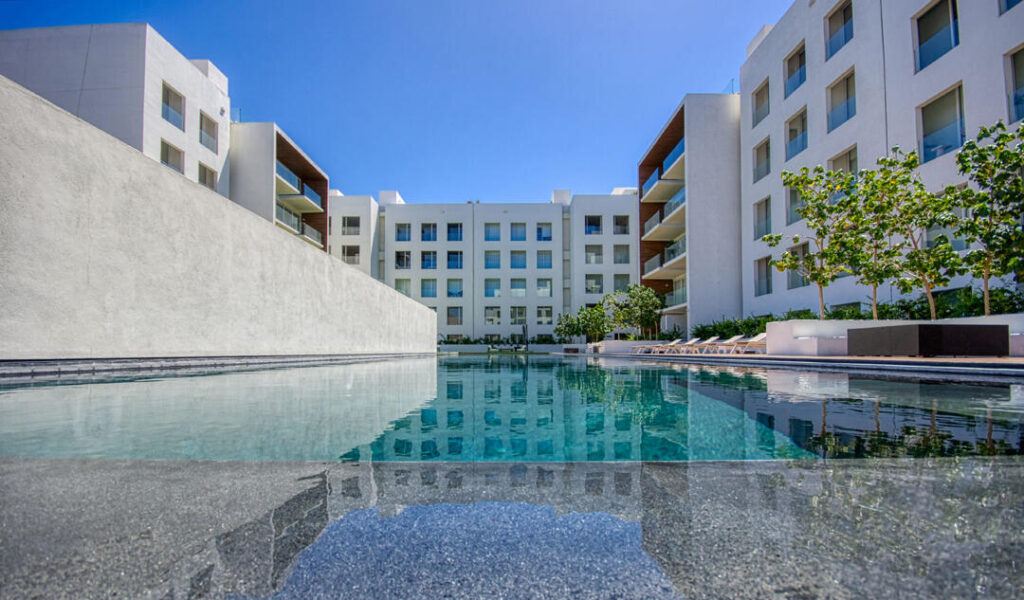 Los Cabos Brisas Del Tezal Ready for delivery! Brisas del Tezal second-floor condo featuring 2 bedrooms and 2 bathrooms in an exclusive low-density community of 36 units across two 4-story elevator buildings. Located minutes from Medano Beach and downtown Cabo. Showcases excellent construction quality and craftsmanship from the developer, including parota wood carpentry and a large, solid front door. Features large-format tile flooring throughout, spacious balcony, granite countertops and backsplash in the kitchen, bathrooms with marble showers to the ceiling, wall-to-wall closets, and a laundry room with space for side-by-side washer and dryer, plus manual washing area and storage. Equipped with 1-ton A/C mini-splits in each bedroom and two in the living area.Enjoy ocean, city, mountain, and sunset – 8 Avenida Pescador, Cabo San Lucas, BS