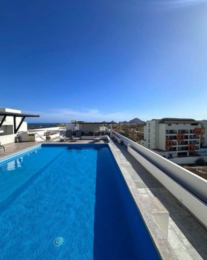 Los Cabos Centro-Todos Santos Discover refined living in the heart of Todos Santos, where everyday life feels like a retreat. Start your mornings by the sparkling pool, surrounded by lush gardens, and unwind in the jacuzzi under the Baja sky. This beautifully designed condominium offers the perfect balance of relaxation, comfort, and convenience.Ideally situated in a central location, you'll enjoy walking-distance access to restaurants, shops, galleries, and the vibrant town center, making it easy to experience everything Todos Santos has to offer. Whether as a full-time residence, vacation escape, or income-producing rental, this property is perfectly positioned to enjoy the best of the area.Thoughtfully finished with quality materials, the condominium will feature exquisite Parota doors, elegant ceramic tile flooring, spacious closets, sleek aluminum windows, and a modern, fully equipped kitchen designed for both everyday living and entertaining. – Bahia 505 Sunrise 5to Nivel, Cabo Corridor, BS