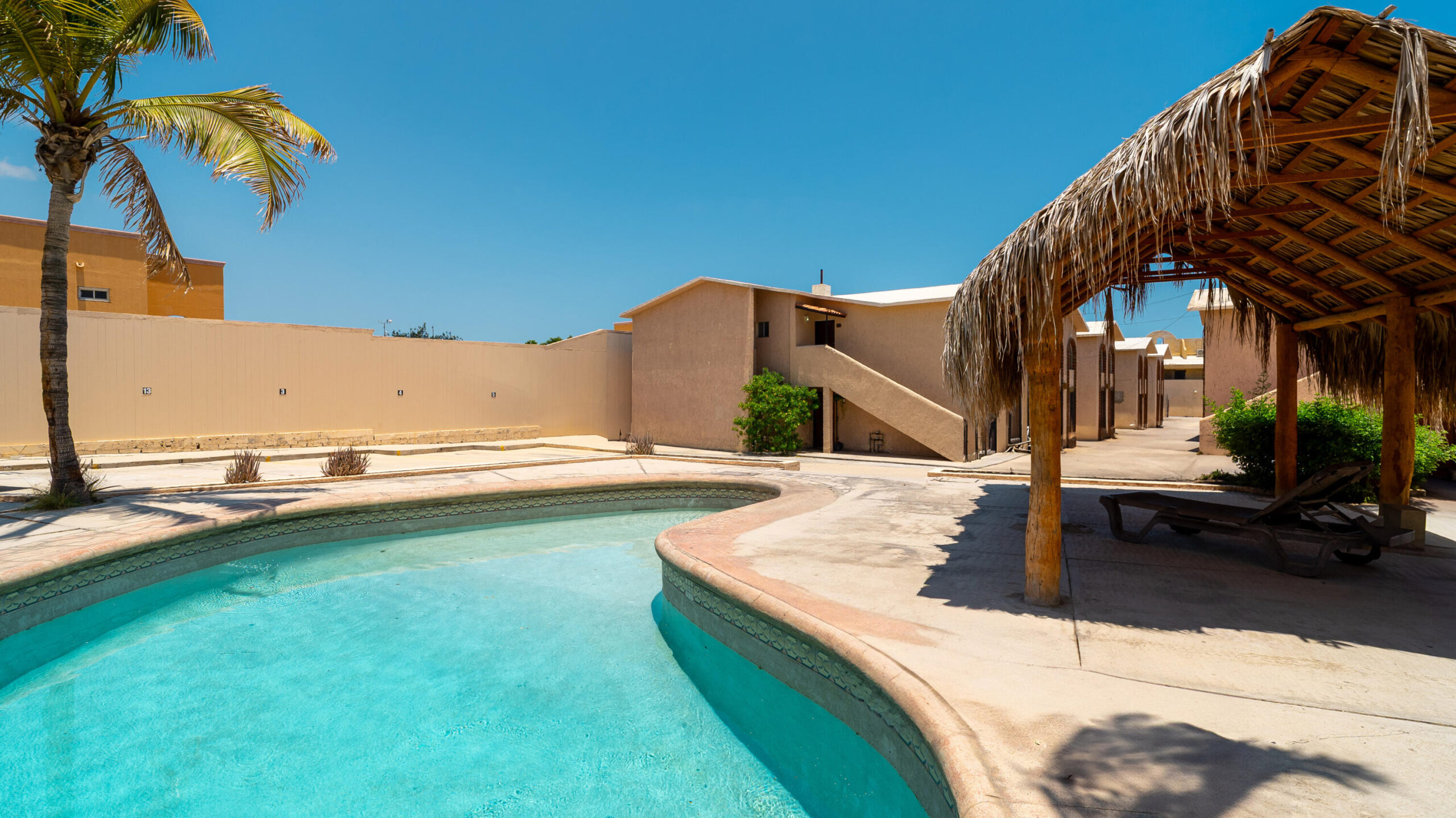 Los Cabos Villas Del Sol Great location, close to all amenities in Cabo San Lucas, walking distance to Medano Beach and to the CSL Marina, restaurants, bars, shops, supermarkets and all vibrant life in Cabo! This 115 m2 (1240 sqft) under AC condo has ceramic floor tiles, high vaulted ceilings, lots of natural light, back terrace with sink, electric water heater, AC mini splits and ceiling fans on each room, hardwood kitchen with propane stove, laundry closet, large living area, one parking space. Villa del Sol is a boutique gated community of only 22 private residencies with common palapa and pool area. Low HOAs. Walk everywhere, enjoy Cabo! for sale