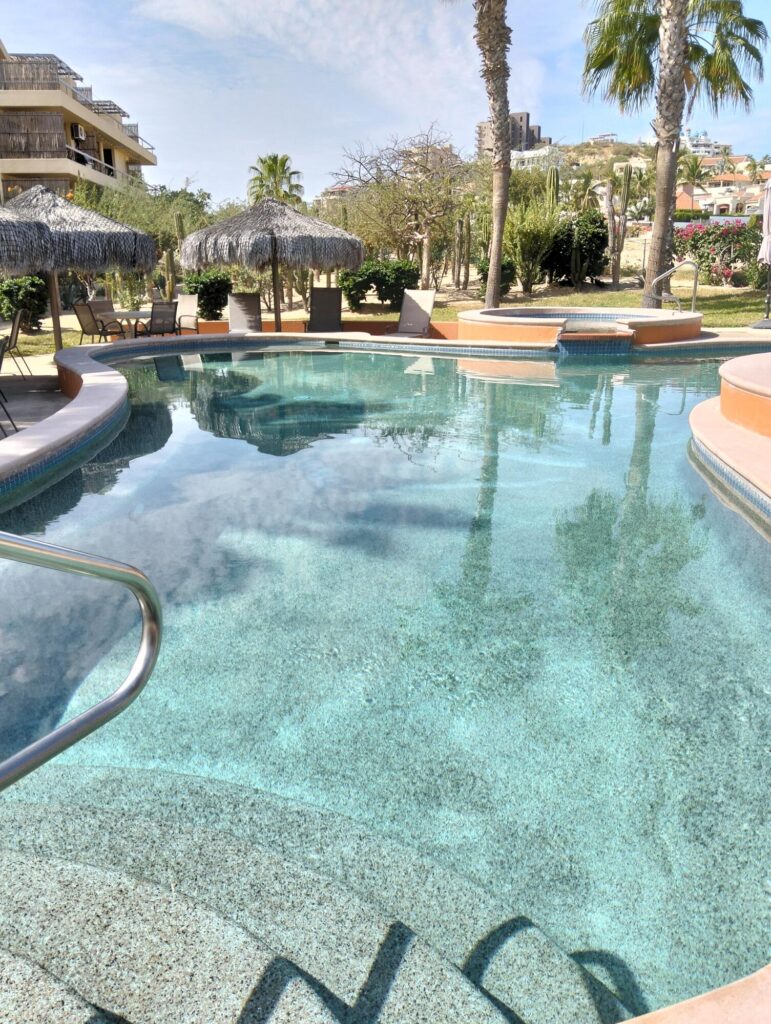Los Cabos Club La Costa End unit 1 bedroom/1 bath unit in great condition in a fully gated community on the Vidanta Golf Course.. Ground level for easy access with large 13' X 18' deck. unit location has both front and side gardens offering more privacy. Has many additional built-ins, has never been a rental and features exclusive assigned parking space out front of the building. F2 offers 3 swimming pools plus hot tubs. Shops, restaurants, beach and public transportation are just a minutes walk away. Comes partially furnished and ready for your personal touches. – Villa 7 F2 Retorno Punta Gorda, San Jose del Cabo, BS