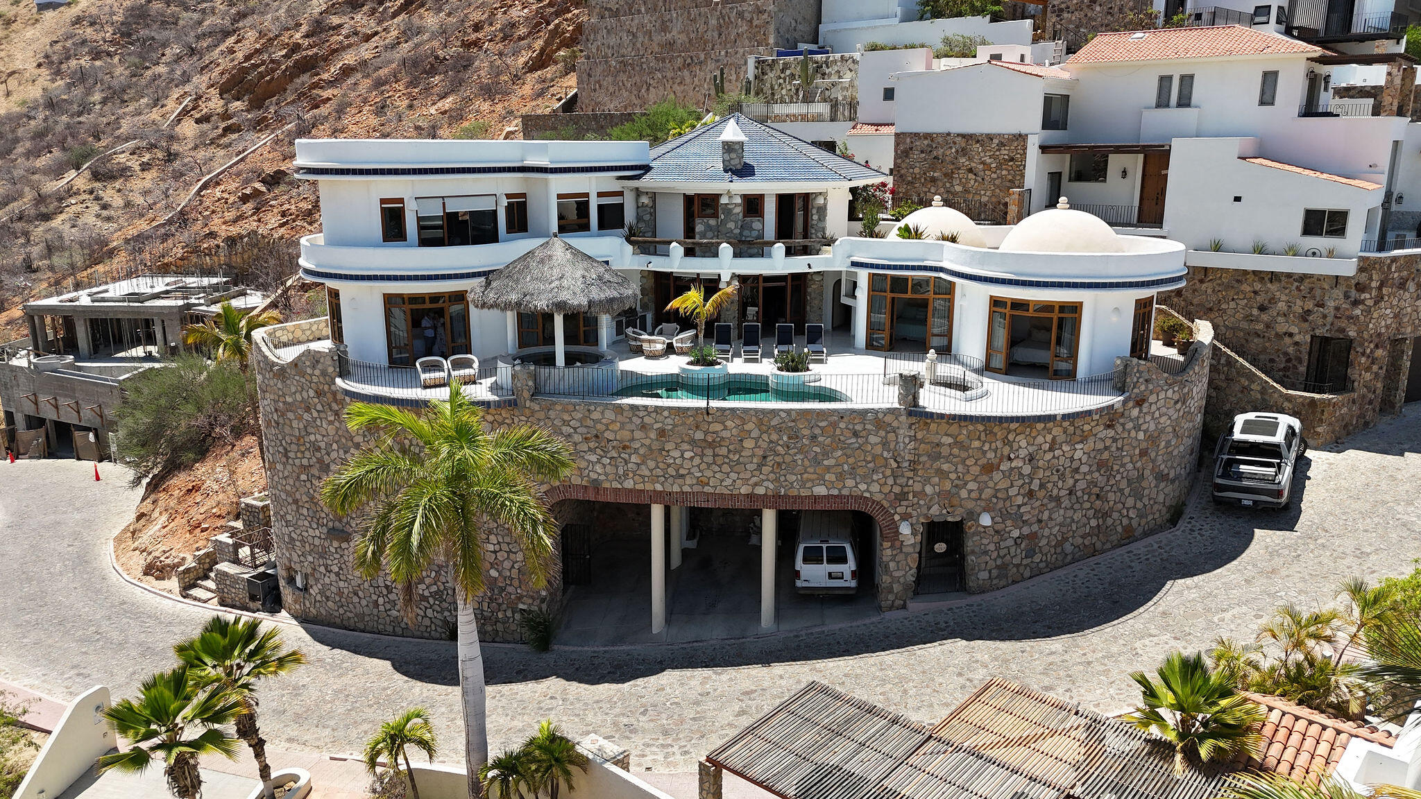 Los Cabos Pedregal Csl Commandingly positioned in the exclusive enclave of Pedregal, Casa El Castillo offers rare walkable proximity to downtown alongside total hillside privacy. This 6-bedroom, 7.5-bathroom architectural estate--originally built by fitness icon Ray Wilson--was masterfully oriented to maximize its vantage point. The result is a breathtaking, unobstructed panorama spanning the Cabo San Lucas Marina, vibrant city lights, and dramatic for sale
