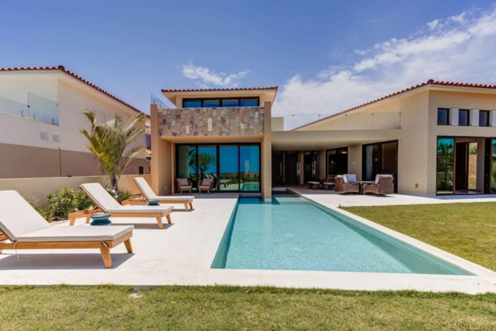 Los Cabos Vista Lagos Stunning fully furnished 3BR villa + service room (considered as the 4th bedroom) in exclusive Club Campestre. Enjoy a heated pool, jacuzzi, and stylish outdoor areas. The primary suite features a private terrace, jacuzzi, spa space, and walk-in closet. Two guest bedrooms with ensuite baths and a versatile service room add comfort. Open-concept kitchen, dining for 8, fire pit, and grill make it ideal for entertaining. Lot size: 9,972 sq ft. Just 15 min from downtown San José del Cabo, near golf, beaches, top restaurants, shopping, hospitals, and schools. Gated community with 24/7 security. Located within the prestigious gates of Club Campestre, Vista Lago 26 is more than a homeit's a refined expression of Los Cabos living. With nearly 10,000 sq ft of land, this villa offers generous space, architectural elegance, and a seamless indoor-outdoor flow designed for both quiet moments and memorable gatherings.This home stands out not only for its layout and finishes but for the ease of living it offers. From the heated pool and private jacuzzi to the fully equipped kitchen and fire pit lounge, every detail was conceived to elevate comfort and connection. Whether hosting family, friends, or guests, the design allows everyone to enjoy privacy and togetherness in equal measure.Beyond the walls of the home, Club Campestre itself becomes an extension of your lifestyle. The community is known for its discreet luxury, sense of calm, and exceptional amenities: an 18-hole Jack Nicklaus Signature golf course, private beach club (optional membership), and a strong sense of neighborhood securitythanks to 24/7 controlled access.But what truly sets this location apart is proximity. In just a few minutes, you can access:The golden sands of Palmilla, Costa Azul and Cabo Surf (ideal for swimming or surfing)Upper Scale supermarkets (La Comer, Chedraui Selecto)Leading hospitals and bilingual private schoolsDowntown San José del Cabo, full of culture, art, and historic charmIf you're an investor, the home's potential as a luxury short-term rental is immediate. The combination of size, amenities, location, and style make it highly attractive to discerning travelers looking for private, secure accommodations with resort-level experiences. If you're a full-time resident or digital nomad, you'll appreciate the stable infrastructure, fiber optic internet, nearby medical support, and ease of access to both San José and Cabo San Lucas via the Transpeninsular Highway (just 100 meters away).The home has also been carefully maintained, is sold fully furnished, and includes modern appliances and home systemsmaking your transition seamless from day one.In summary: Vista Lago 26 is turnkey luxury with long-term value. Whether you're looking to invest, relocate, or upgrade your lifestyle, this home delivers Cabo's promise of sun, space, and soulbeautifully. – #39 Cresta Del Mar, Cabo Corridor, BS
