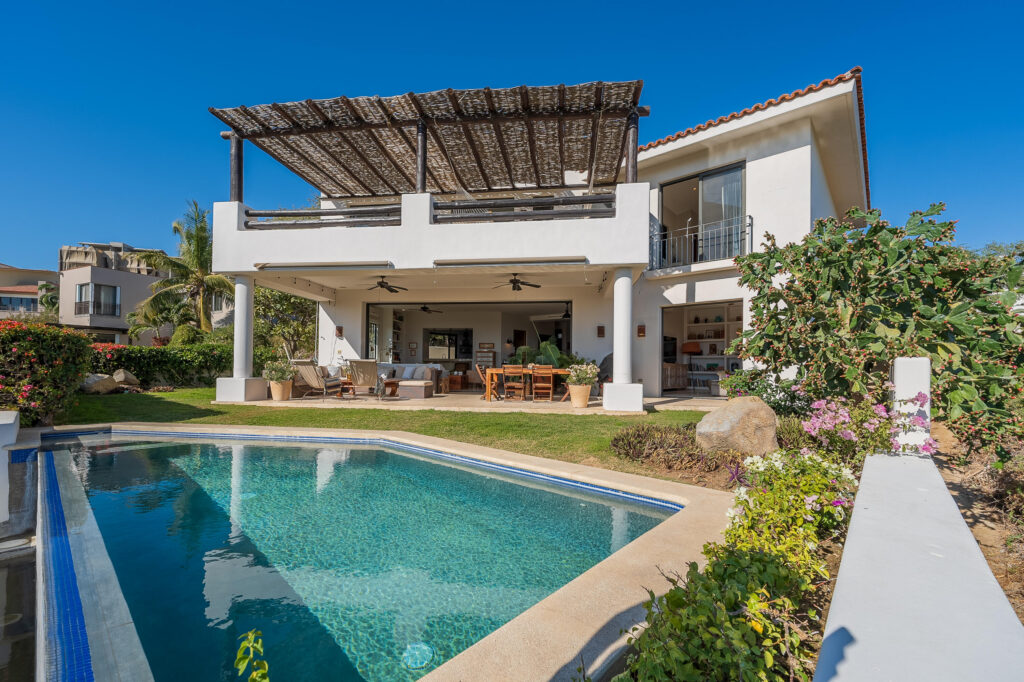 Los Cabos Rancho Paraiso Ests Casa Sol is a pristine, recently completed luxury residence (April 2025) that offers the perfect blend of modern design and estate-sized privacy offering 306.42 square meters of total construction set on an exceptional 1,266.195 square meter lot, a rare feature that immediately sets this property apart within Rancho Paraíso. The interior features 3 spacious bedrooms, 3.5 bathrooms, and a private office. The expansive lot provides a true estate-like feel, delivering space, privacy, and long-term value that is increasingly difficult to find in newer luxury homes. The size of the lot allows for wide separation from neighboring residences, generous setbacks, and beautifully scaled outdoor living areas. It creates an open, airy environment where natural light, ocean breezes, an An empty lot below the property is subject to height restrictions, helping preserve – Club Campestre, San Jose del Cabo, BS