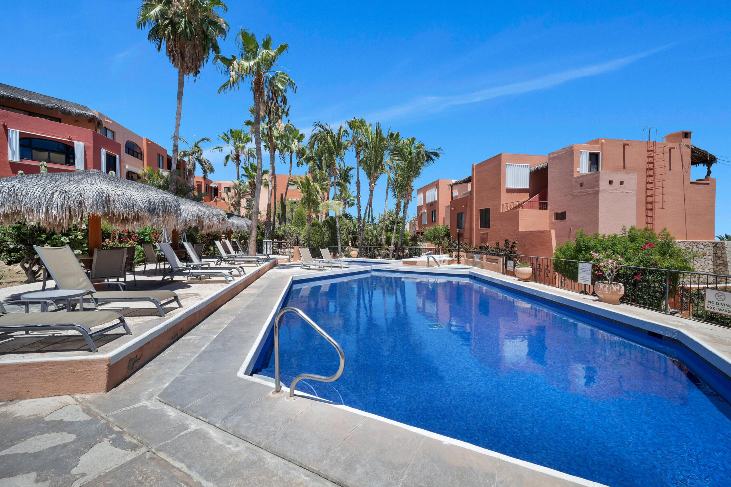 Los Cabos Tesoro Not all luxury condos are created equal. This extraordinary end-unit residence at Tesoro Resort stands apart as one of the most unique offerings in Cabo San Lucas.Boasting approximately 1,800 square feet of bright, open living space, this two-bedroom, two-bath condominium features an oversized primary suite, dedicated laundry area, and a spacious floor plan designed to capture the energy and beauty of the marina from nearly every angle.The true showpiece is the spectacular palapa-covered terrace--one of the largest private outdoor living spaces in the marina. Complete with a custom Jacuzzi, this incredible outdoor retreat functions as a second living room, dining area, and entertainment space all in one. From sunrise to sunset, enjoy commanding for sale